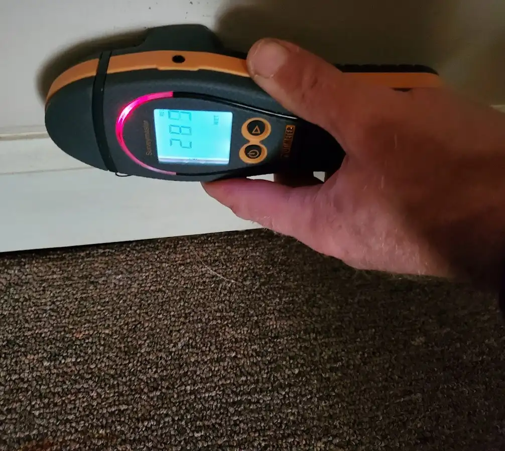 Moisture detection at baseboard during Storm Damage Restoration in Menifee